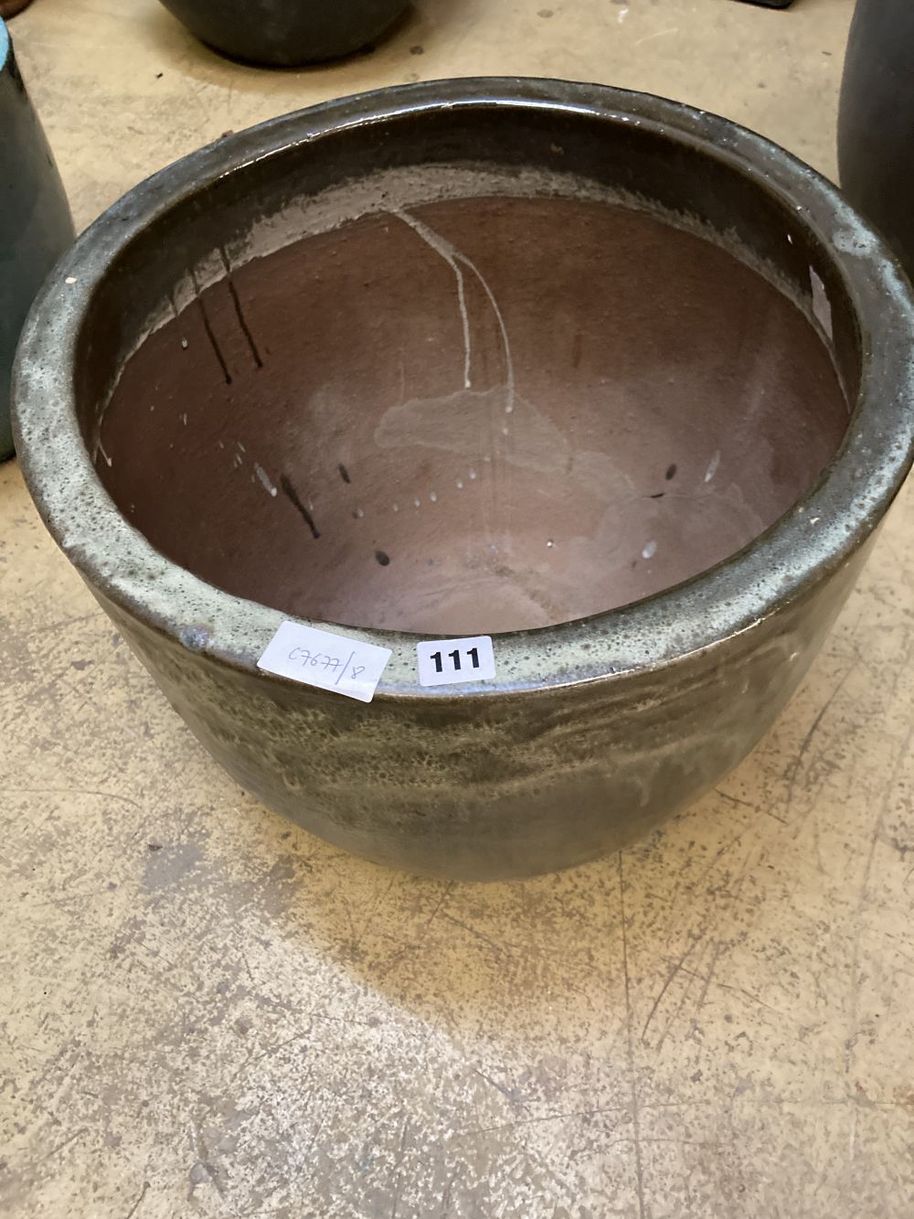 A circular green glazed garden planter, width 48cm, height 39cm